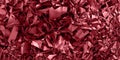Red colorful glossy crushed foil texture, christmas feeling. Wide panorama background.