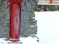 Red Column Sculpture on the Snow