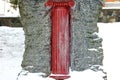 Red Column Sculpture on the Snow