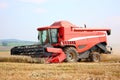 A red combine harvester