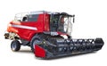 Red combine harvester, agriculture machinery over white, with clipping path Royalty Free Stock Photo