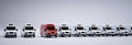 Red commercial van and fleet of white trucks. Transport. Transport and shipping