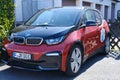 red compact city car, first mass-produced Hybrid electric car German company BMW, concept minimizing environmental impact,