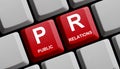 Red Computer keyboard showing PR - Public Relations