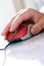 Red computer mouse and hand Royalty Free Stock Photo