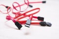 Red computer wires for hard drive on light background Royalty Free Stock Photo