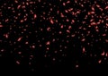 Red confetti, falling paper ribbons isolated on dark background. Birthday party decoration. Royalty Free Stock Photo