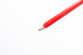 Red construction pencil isolated on white