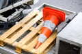 Red construction warning cone on a pallet