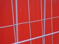 Red container with grey iron fences