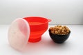 Collapsible red silicone container for microwave popcorn