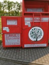 Red container for used items in Germany. Recycling and further use