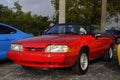 Red convertible Ford Mustang 5.0