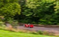 A red convertible sports car in the race