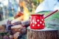 Red cooking pot camping fire. Royalty Free Stock Photo