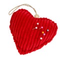 Red cord fabric heart shape pincushion isolated on white. With pins.