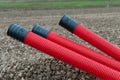 Red corrugated plastic pipes Royalty Free Stock Photo