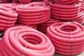 Red corrugated plastic pipes used for underground electrical lines Royalty Free Stock Photo