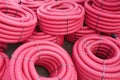 Red corrugated plastic pipes used for underground electrical lines Royalty Free Stock Photo