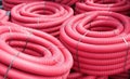 Red corrugated plastic pipes used for underground electrical lines