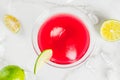 Red cosmopolitan cocktail with lime Royalty Free Stock Photo