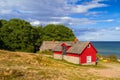 Red cottage house at the beach of Baltic sea Royalty Free Stock Photo