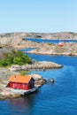 Red cottage by the sea Royalty Free Stock Photo