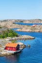 Red cottage by the sea Royalty Free Stock Photo