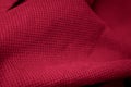 Red cotton fabric with visible details. background or textura