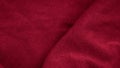 Red cotton fabric with visible details. background or textura