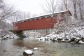 Red covered bridge in a winter wonderland Royalty Free Stock Photo
