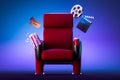 Red Cozy Cinema Armchair With Comfortable Elbows Near Popcorn Bowl, Tickets, Film Reel And Movie Clapper. 3d Rendering Royalty Free Stock Photo