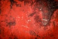Red cracked paint on old concrete Royalty Free Stock Photo