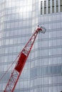 Red crane. High rise modern skyscraper building construction industry