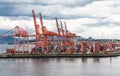 Red Cranes and Shipping Containers Royalty Free Stock Photo