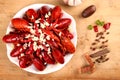 Red crawfish garlic on white plate with spices on wooden table Royalty Free Stock Photo