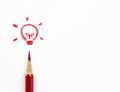 Red crayons drawing light bulb Royalty Free Stock Photo