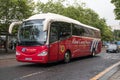 Red and cream West Coast Morors single decker coach in service. Public Transport