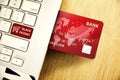 Red Credit card inserted to laptop with Black friday sign