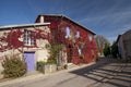 Red creeper plant on wall of little house, France