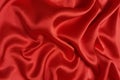 Red crepe satin crumpled or wavy fabric texture background. Abstract linen cloth soft waves. Silk fabric. Smooth elegant Royalty Free Stock Photo