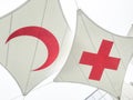 Red crescent and red cross flag together Royalty Free Stock Photo