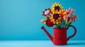 Red crochet watering can and spring flowers multi-colored crochet sunflowers on a blue background. Advertising banner.