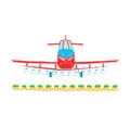 Red crop duster airplane spraying over green farm field. Agricultural aircraft action pest Royalty Free Stock Photo