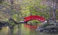 Red cross bridge in Japanese garden Royalty Free Stock Photo