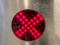 Red cross on equipment in the subway. the turnstile does not let the passenger through without payment. red button glows with neon