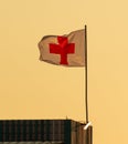 Red cross flag against the sky Royalty Free Stock Photo