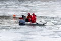 Red cross volunteers in a boat icy lake Royalty Free Stock Photo