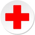 Red cross on a white circle.