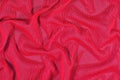 Red crumpled nonwoven fabric background Royalty Free Stock Photo